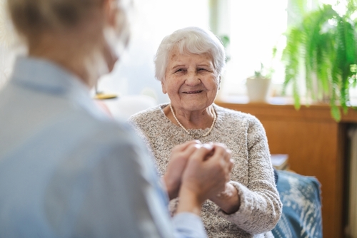 Senior woman geting support from caregiver